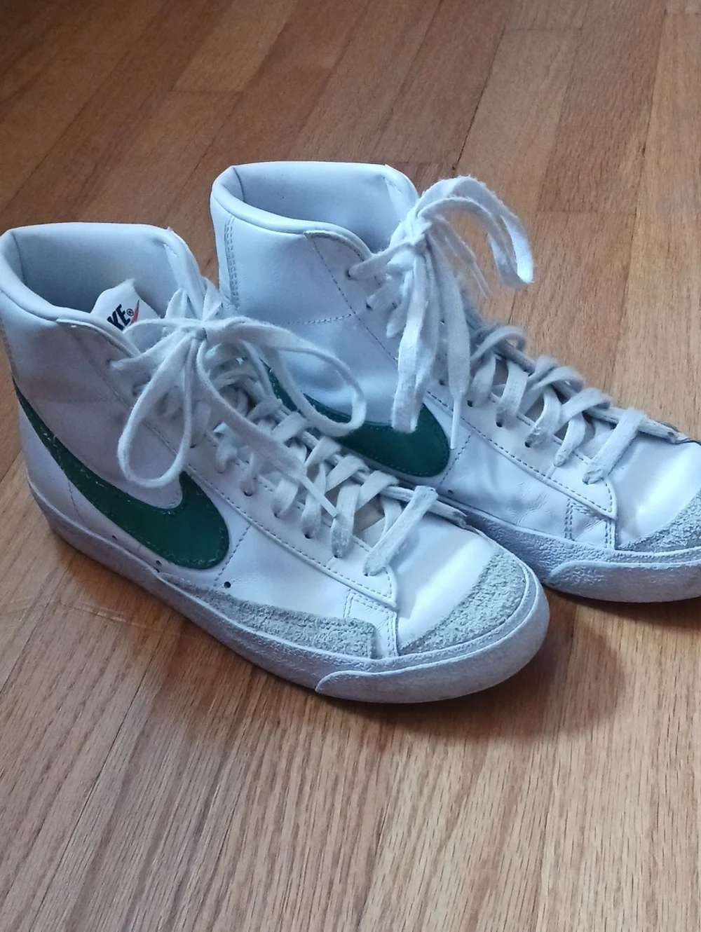 Nike White High-Top Sneakers with Green Swoosh